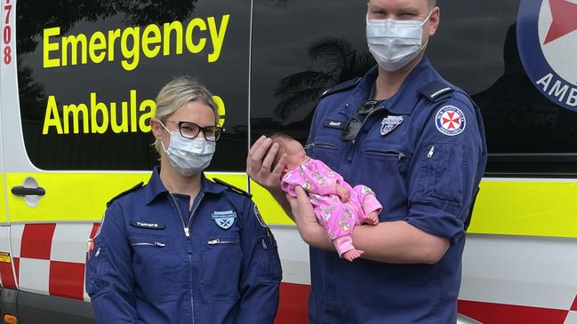 Paramedic Geoff Edwards with baby Rosie-May who he helped deliver