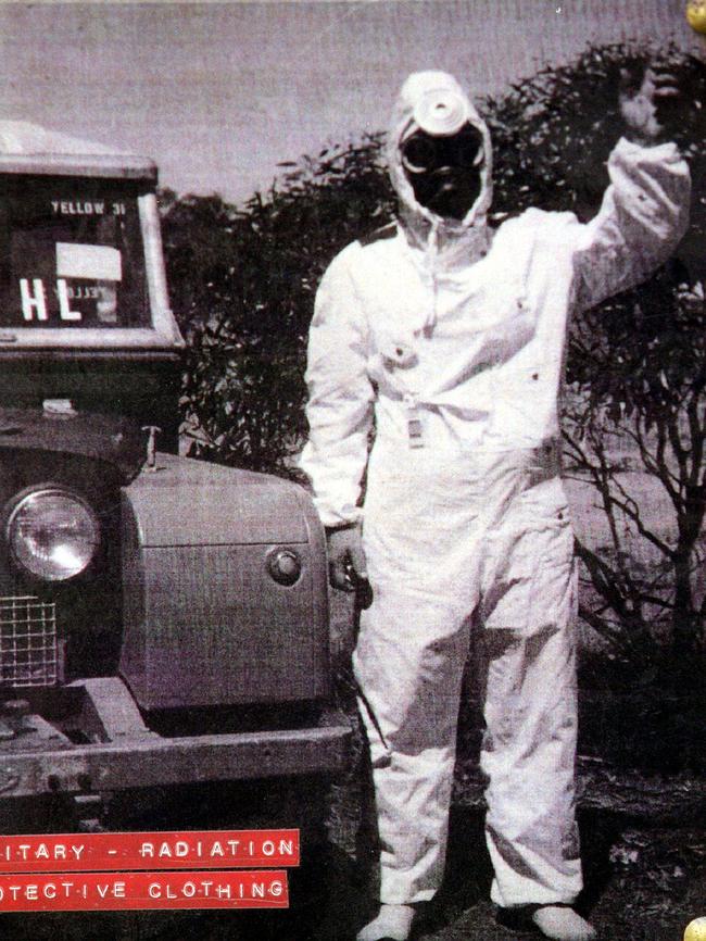 A worker in protective clothing at Maralinga.