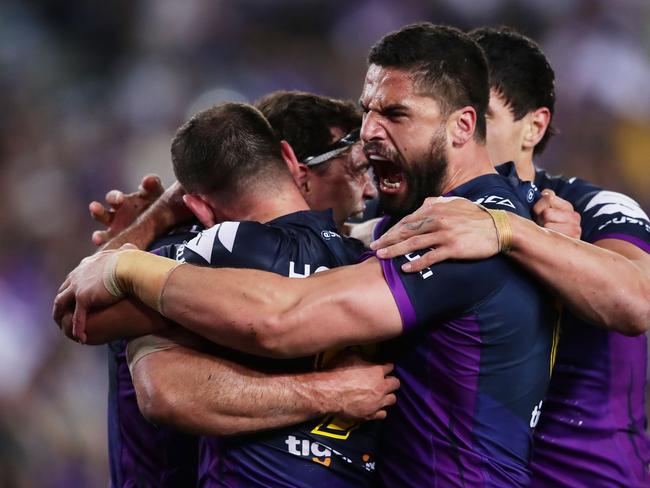 SYDNEY, AUSTRALIA - OCTOBER 01:  Jesse Bromwich of the Storm celebrates the try to Dale Finucane with team mates  during the 2017 NRL Grand Final match between the Melbourne Storm and the North Queensland Cowboys at ANZ Stadium on October 1, 2017 in Sydney, Australia.  (Photo by Matt King/Getty Images)