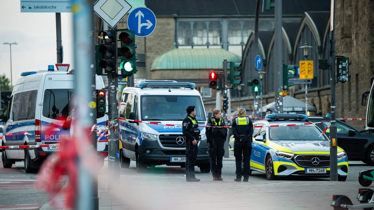 Police at the scene at Hamburg’s main train station where at least 17 people were stabbed. Picture: Jonas Walzberg / AFP