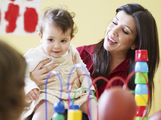 Generic photo of a childcare worker and children in a daycare centre