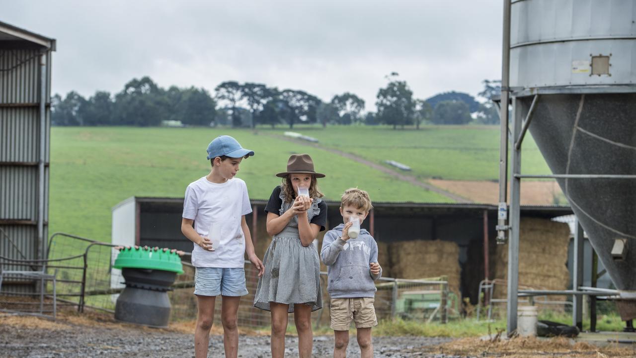 Billy, Evie and Max enjoy glasses of milk. Picture: Zoe Phillips