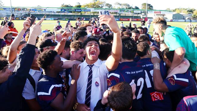 LANGER trophy schoolboy rugby league grand final between Palm Beach Currumbin SHS and Ipswich SHS. Ipswich SHS students celebrate with their winning team.Picture: NIGEL HALLETT