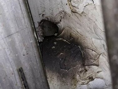 "Black rodent grease" around a hole in the wall at Mr Curry in Fortitude Valley.