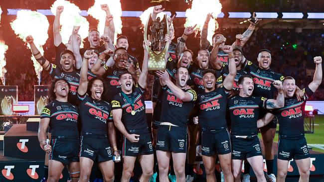 Panthers players celebrate with the trophy after winning the 2023 NRL grand final. Picture: AFP