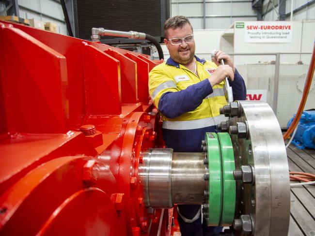 Mackay, 29 Nov 18, Mackay Mining Service Industries benefit from Adani Mining Go Ahead.Adam Hawes, Workshop Supervisor at SEW Eurodrive, working on their drive system Balancer.Photo : Daryl Wright.