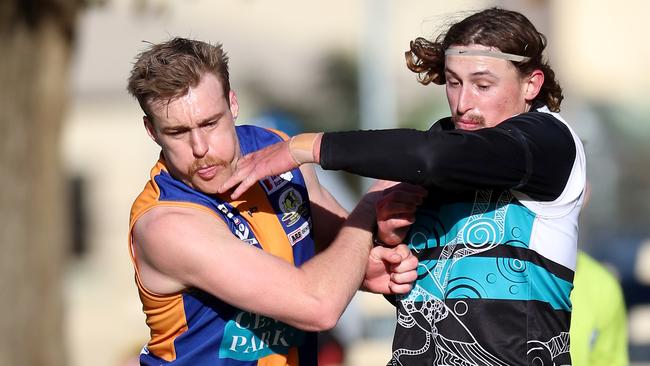 Maryborough Kya Lanfranchi battles Golden Square’s Jayden Burke for the ball. The loss of Maryborough could leave Bendigo with eight teams next year. Picture Yuri Kouzmin