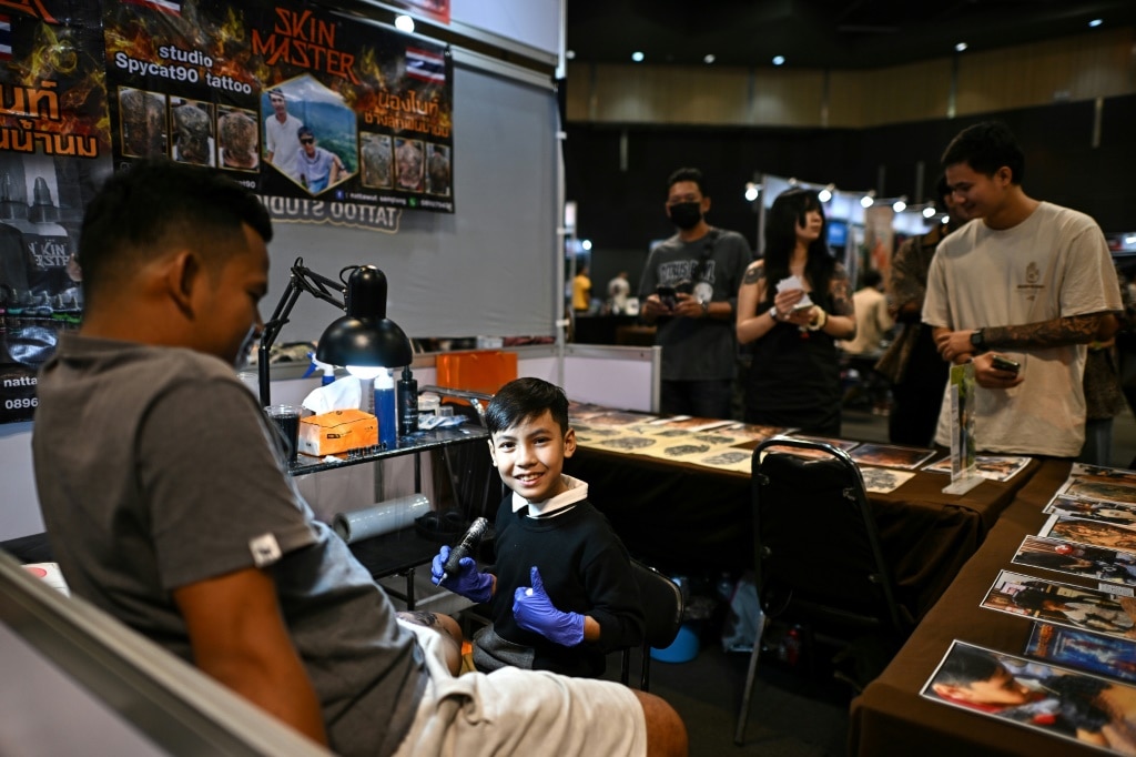 Nine-year-old Thai tattooist makes his mark