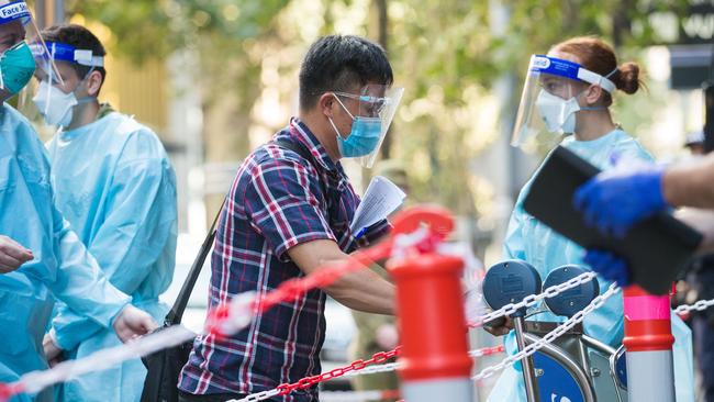 International travellers arrive at the Intercontinental Hotel in Melbourne to complete two weeks of quarantine. Picture: Paul Jeffers