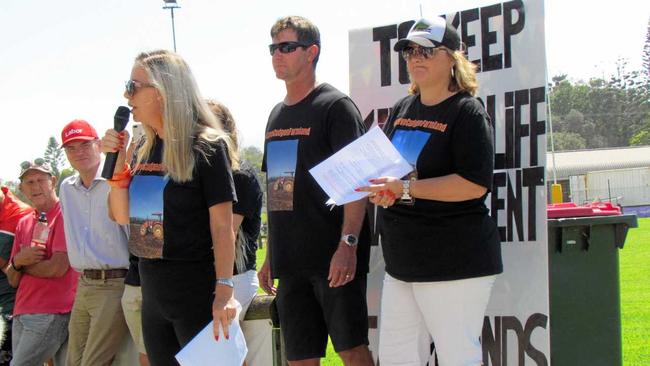 Kristie Hedley from Team Relocate addresses the protest rally with James and Hayley Paddon (right). Picture: Nikki Todd