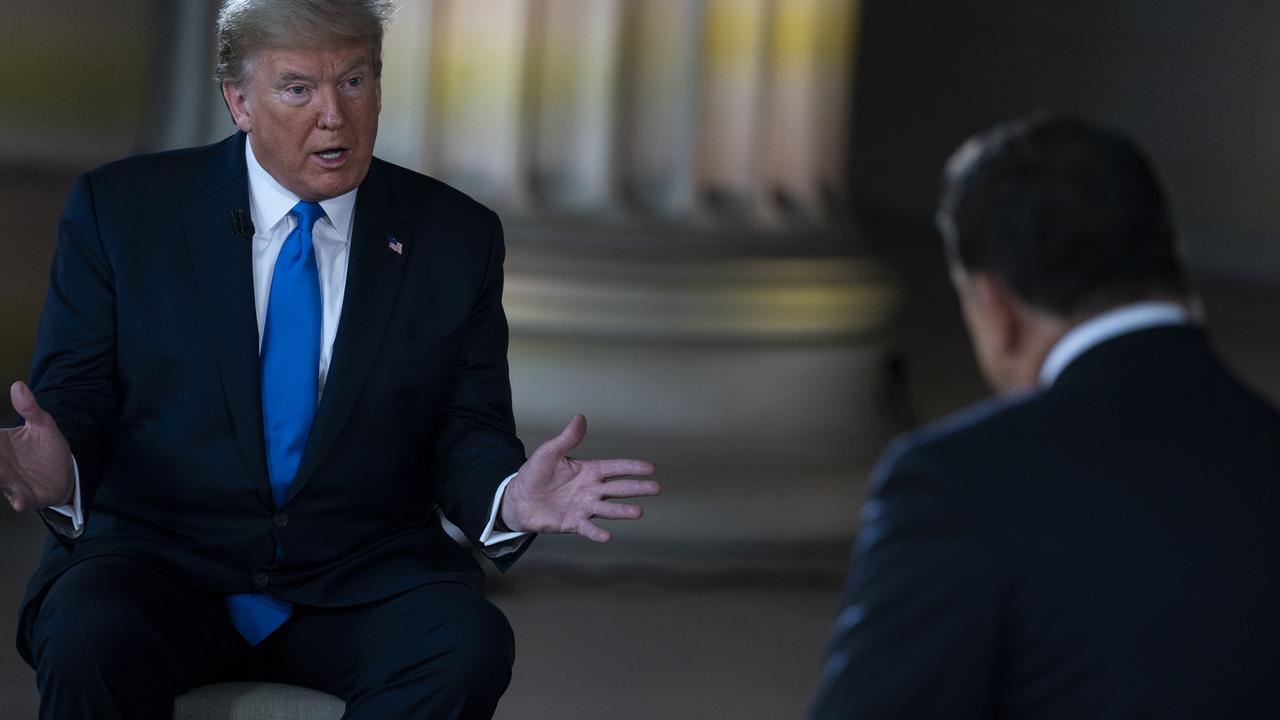 President Donald Trump and Fox News anchor Bret Baier at today’s town hall. Picture: Evan Vucci/AP