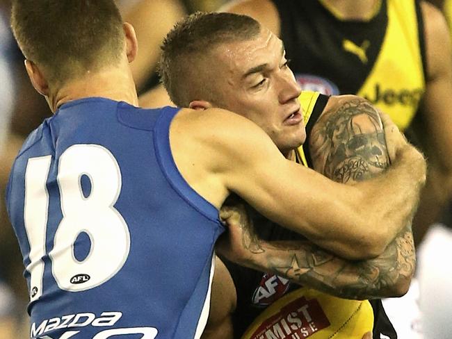 Martin tries to shrug off Shaun Atley. Picture: Wayne Ludbey