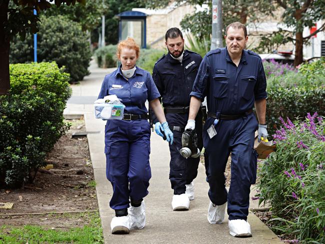 Forensic police enter the Riverwood apartment block where a three-year-old boy was found dead. Picture: Adam Yip