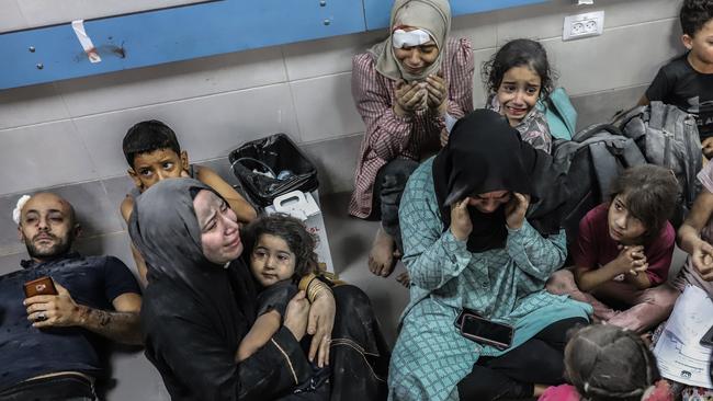 Injured Palestinians wait to receive medical attention at al-Shifa hospital in Gaza City.