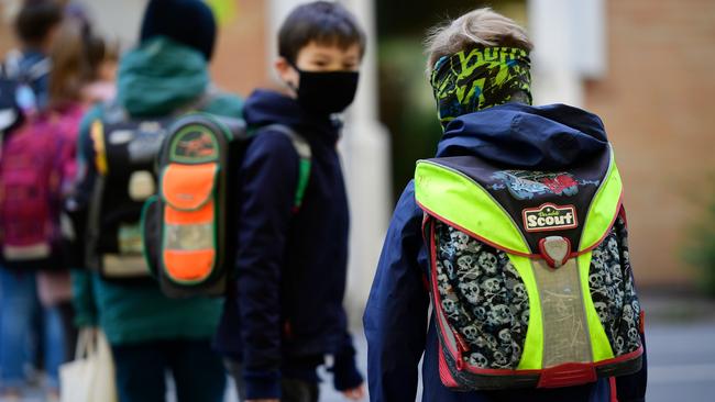 Children respect social distancing as they line up to enter the Petri primary school in Dortmund, Germany. Picture: AFP