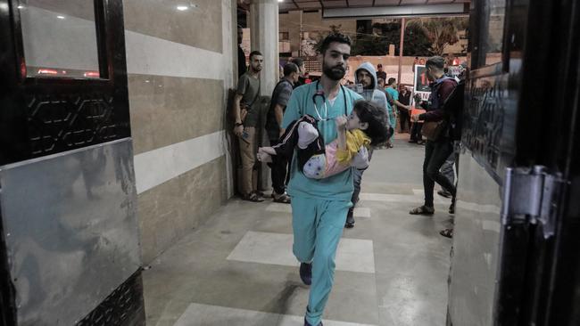 Palestinians injured in air strikes arrive at Nasser Medical Hospital in Khan Yunis, Gaza. Picture: Getty