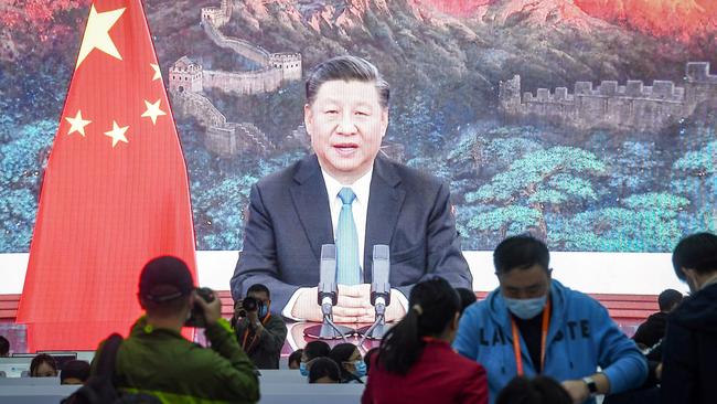 A screen shows Chinese President Xi Jinping delivering a speech via video for the opening ceremony of the 3rd China International Import Expo (CIIE). Picture: AFP