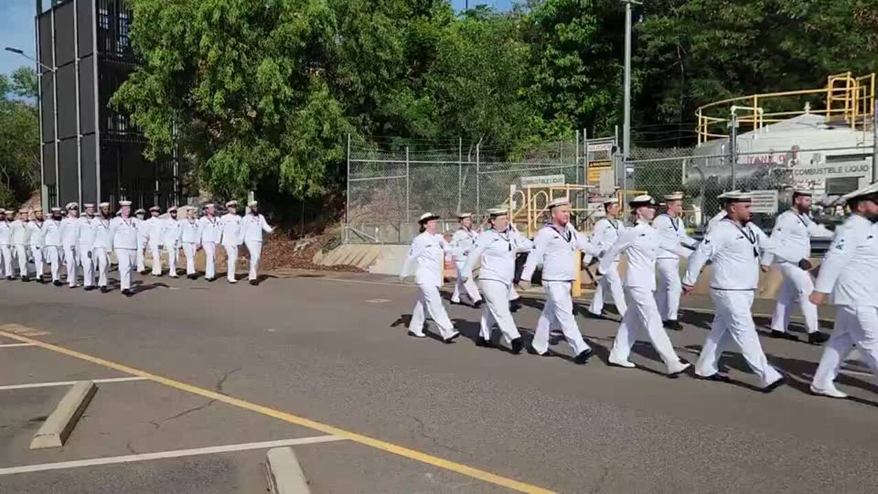 Crew of the four new Evolved Cape Class Patrol Boats march to their newly commissioned ships