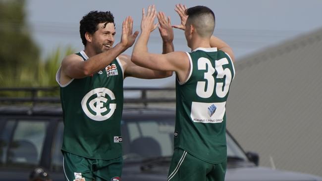 Harvey Daniher and Matt Haynes celebrate a Greensborough goal. Picture: Valeriu Campan