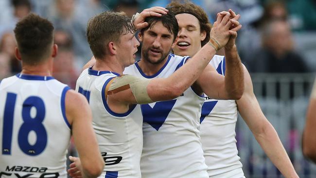 Jarrad Waite celebrates a goal with Jack Ziebell and Ben Brown.