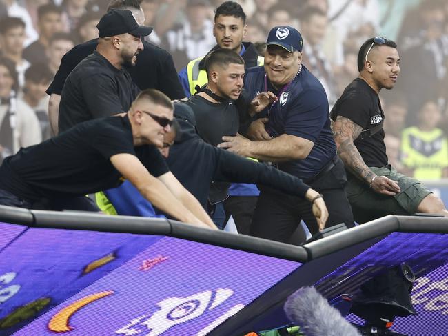 MELBOURNE, AUSTRALIA - DECEMBER 17: Fans storm the pitch in protest during the round eight A-League Men's match between Melbourne City and Melbourne Victory at AAMI Park, on December 17, 2022, in Melbourne, Australia. (Photo by Darrian Traynor/Getty Images)