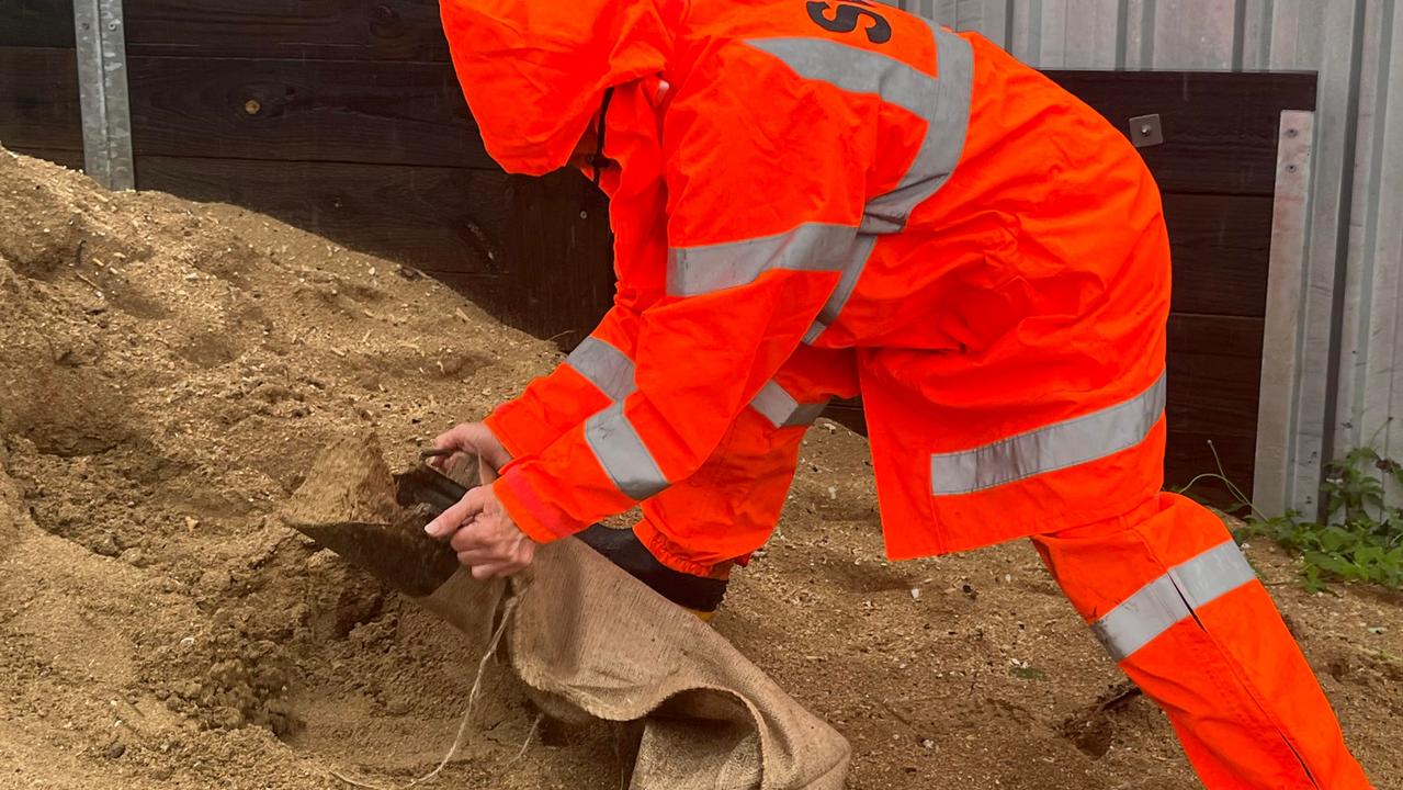 Bev Aitcheson from Maryborough SES filling sandbags.