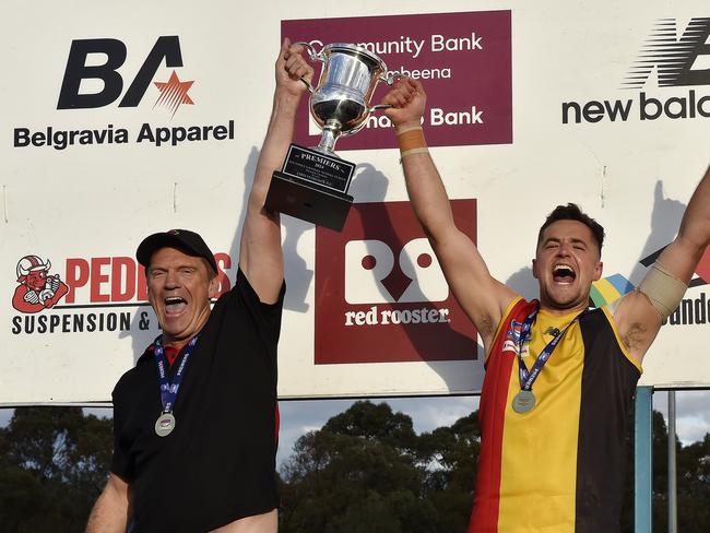 Cheltenham Seniors coach Justin Pickering holds the 2024 trophy with Captain Jack Worrell. Picture: Andrew Batsch