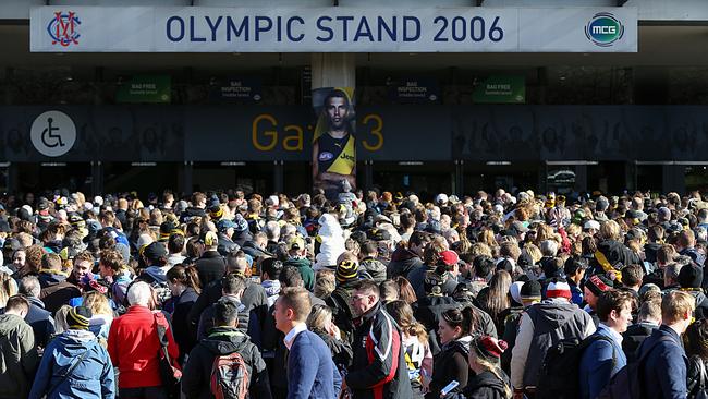 Fans line-up outside to enter the MCG. Picture: Ian Currie