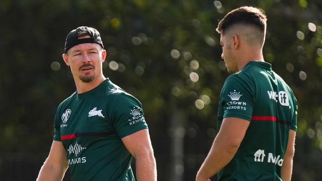 Rabbitohs hooker Damien Cook with rising rake Peter Mamouzelos. Photo: Rabbitohs