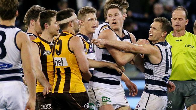 Captains Luke Hodge and Joel Selwood tangle at the final break. Picture: Colleen Petch