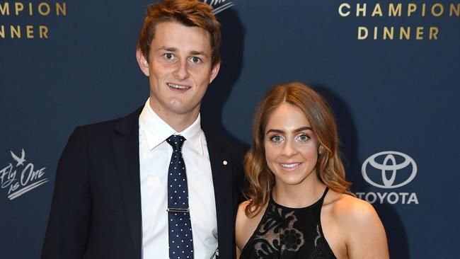 Matt Crouch, with partner Ellie Symons, woin the Crows’ best and fairest. Picture: Tom Huntley