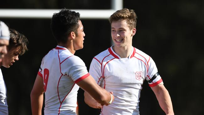 Ipswich Grammar School flyhalf Sam Walker celebrates with teammate Kalani Thomas.