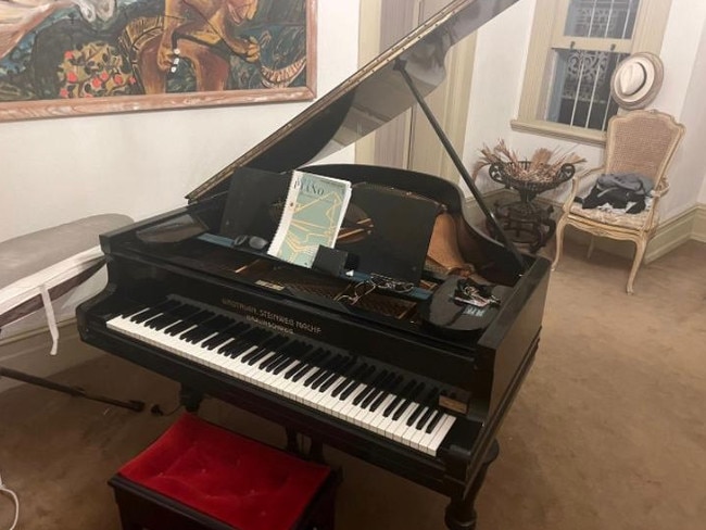 The piano in the room in Auerbach’s apartment. Picture: news.com.au