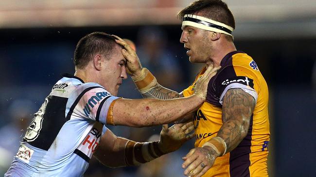 Paul Gallen of the Sharks and Josh McGuire of the Broncos push and shove.