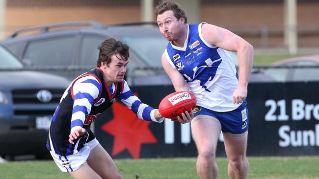 Mitchell Streiff looks to fire off a handball for Sunbury Kangaroos. Picture: Hamish Blair