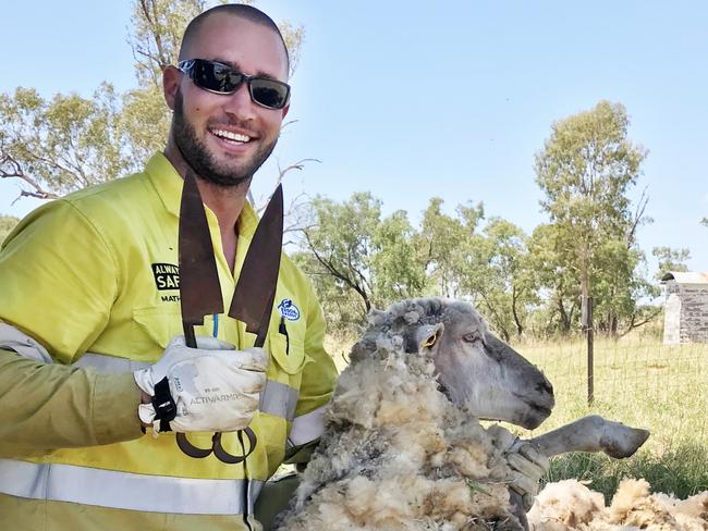 Ben Ridge with a sheep he saved. Picture: Supplied