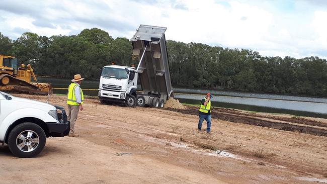 The trucks have returned to Black Swan Lake as the fill-in begins at the so-called Gold Coast borrow pit.