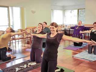 FIT TOGETHER: Staff at Dougherty Villa enjoy an afternoon of Pilates as part of their 'Biggest Loser' initiative. Picture: Tim Jarrett