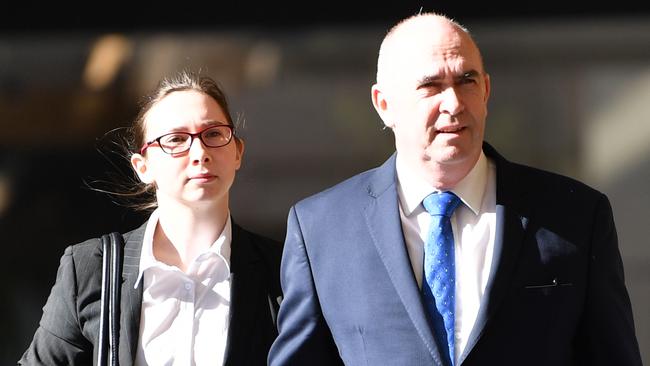 Timothy Sexton, right, and a supporter enter the District Court for his trial. Picture: AAP/David Mariuz.