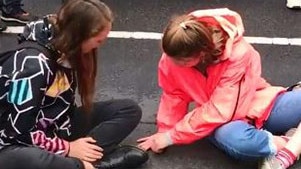 Protesters superglue themselves to King's Bridge in Melbourne. Picture: Twitter.