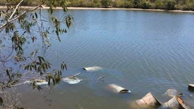 Drums dumped in a tidal lagoon near Yeppoon.