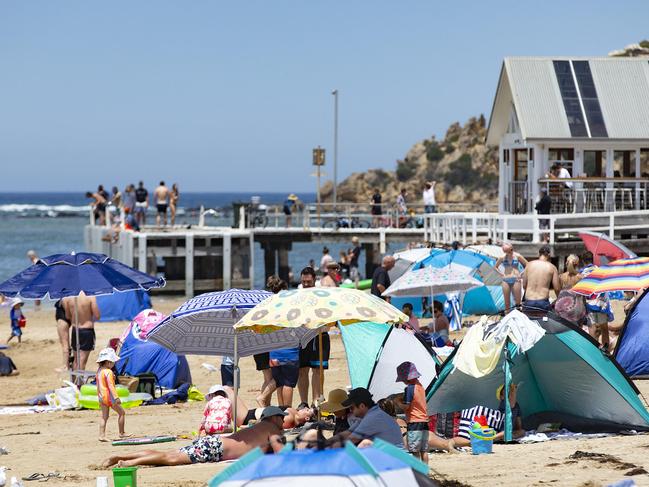 Barwon Heads beach was popular for staying cool for families as temperatures rose on Thursday. Picture: Sarah Matray