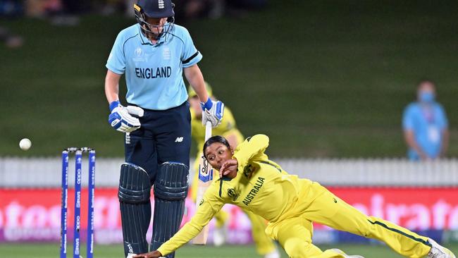 Alana King dives to try and stop a ball off her