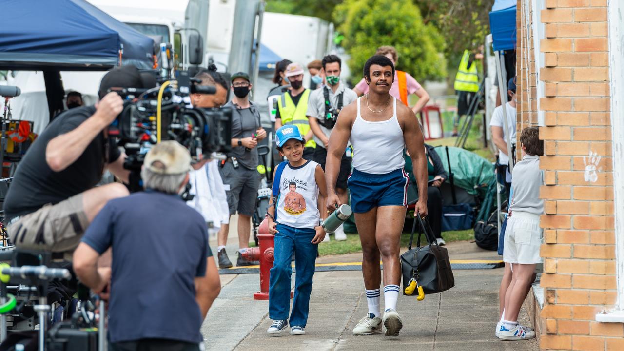 Young Rock actors Adrian Groulx, as young Dwayne, and Joseph Lee Anderson, as Rocky Johnson, shooting scenes at Wynnum, Brisbane. Picture: Nigel Wesley