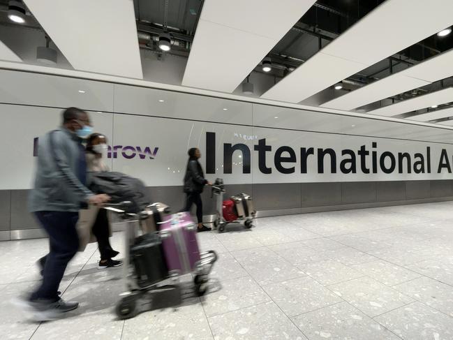 International passengers walk through the arrivals area at Terminal 5 at Heathrow Airport in London, England. Picture: Leon Neal/Getty Images