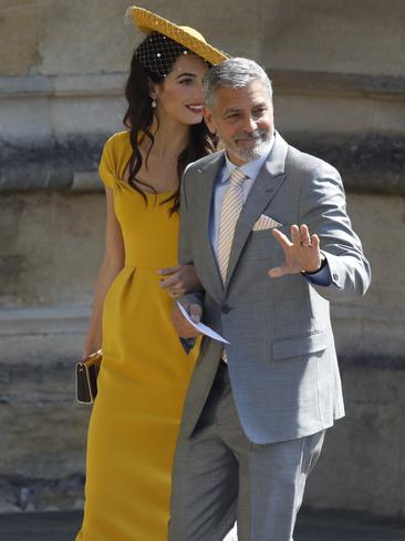 They waved to the crowd as they entered the church. Picture: AP