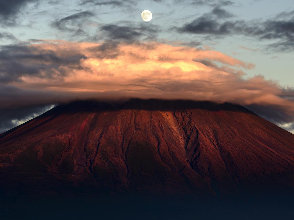 Image Name: Moon above Red Fuji Photographer Name: Takashi Nakazawa Year: 2018 Image Description: Copyright: Takashi Nakazawa, Japan, Commended, Open Landscape & Nature and 3rd Place, Japan National Award. Picture: Sony World Photography Awards/ Takashi Nakazawa