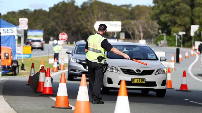 Police checking people crossing the Queensland / New South Wales border. Picture: Nigel Hallett