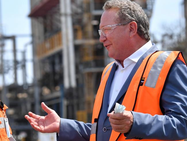 Incitec Pivot worker Christie Rossi (left) is seen with Andrew 'Twiggy' Forrest from Fortescue Future Industries during a hydrogen announcement at Incitec Pivot on Gibson Island in Brisbane, Monday, October 11, 2021.. The Queensland government announced that Incitec Pivot has reached an agreement with Fortescue Future Industries to study the feasibility of green ammonia production at Incitec Pivot's Gibson Island production facility in Brisbane. (AAP Image/Darren England) NO ARCHIVING