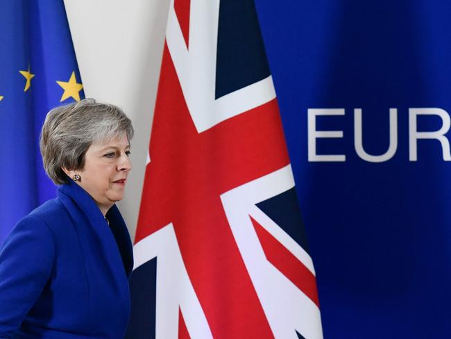 Britain's Prime Minister Theresa May arrives to give a press conference following a special meeting of the European Council to endorse the draft Brexit withdrawal agreement and to approve the draft political declaration on future EU-UK relations on November 25, 2018 in Brussels. - The European Union's top official urged British lawmakers to ratify the Brexit deal Prime Minister Theresa May has negotiated with European leaders, warning it will not be modified. "This is the best deal possible for Britain, this is the best deal possible for Europe. This is the only deal possible," Jean-Claude Juncker, the president of the European Commission, said after a Brussels summit. (Photo by Philippe LOPEZ / AFP)